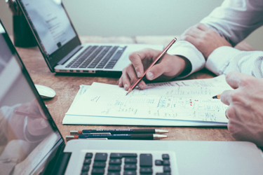 Person Holding Pencil Near Laptop Computer 926Ad1292d67cdc68637146042046e0a