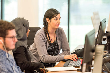 Unknown Persons Using Computer Indoors 9504D194ab33a27e799283e89a88d021